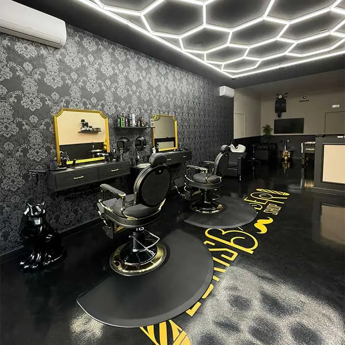 Premium barber shop interior with black and gold detailing